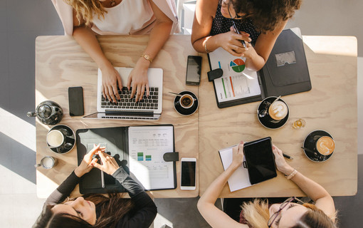 Group of women working together in coffee shop