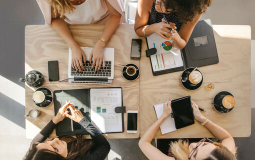 Group of women working together in coffee shop