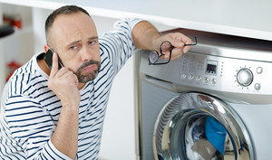 man fed up during call to washing machine helpline