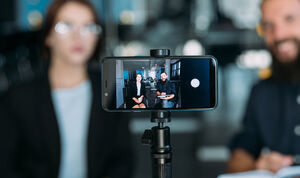 business man woman video phone coaching workshop