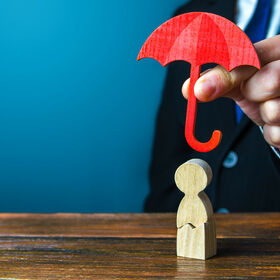 Insurance agent holds an umbrella over a men with a crack. Rehabilitation after trauma, drugs, alcohol. Health and life insurance. Psychological help. Social support. Recovery. Protectorate, patronage