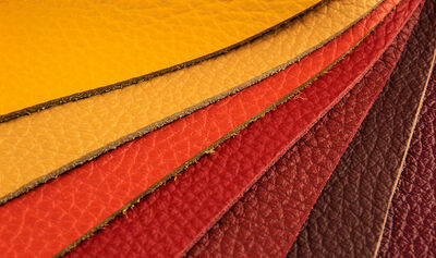 Natural leather upholstery samples with stitching